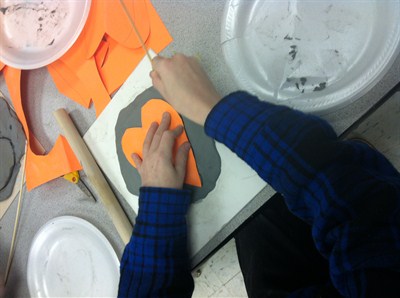 Students working on different pottery steps